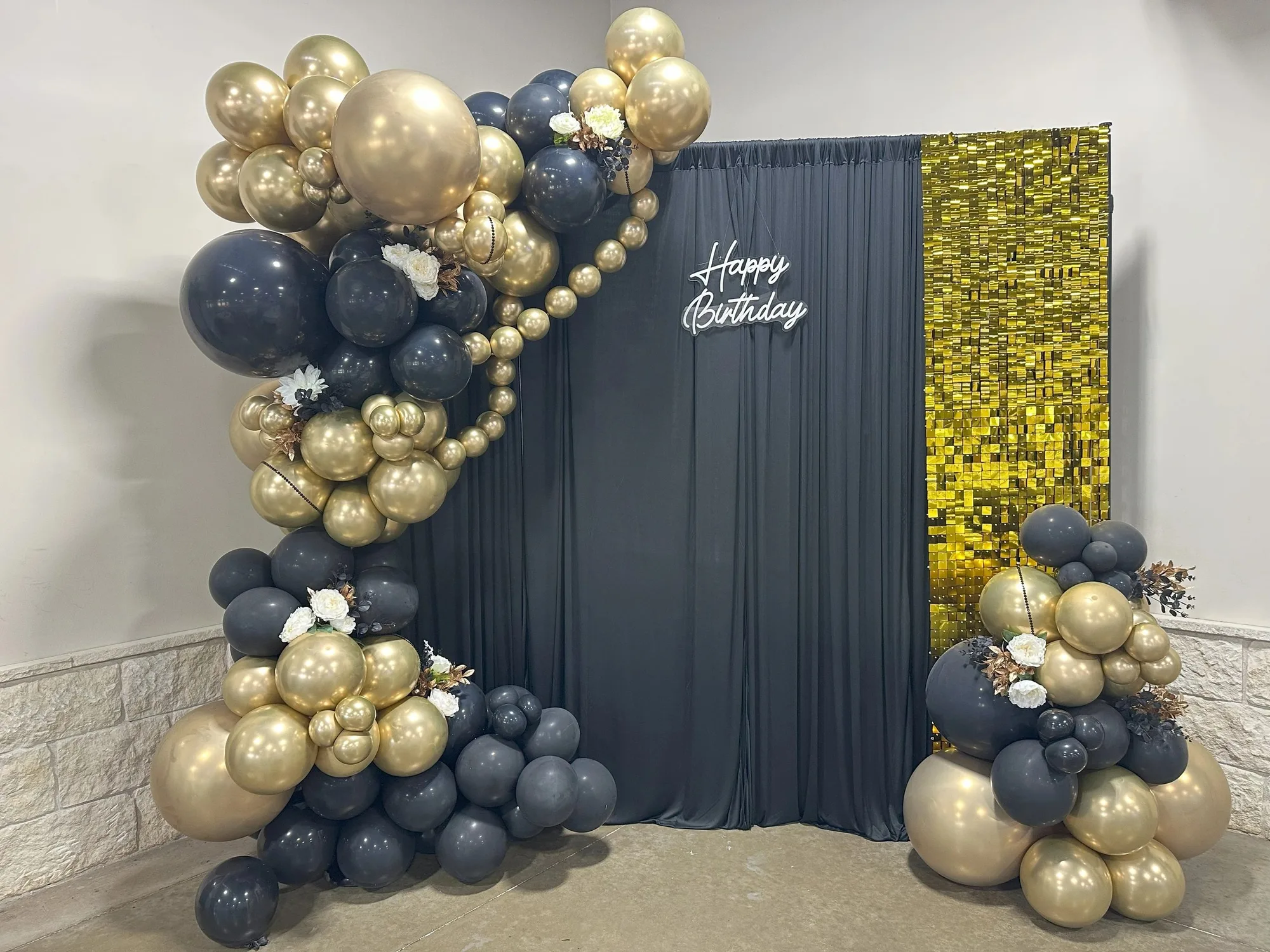 Navy and gold balloon backdrop with curtain and sequin panels