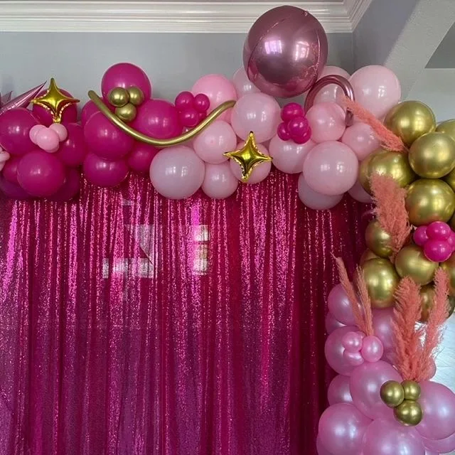 Pink and gold balloon backdrop with a sparkling pink curtain