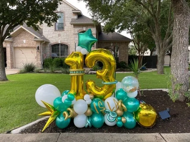 Gold thirteen freestanding balloon display with teal and white accents