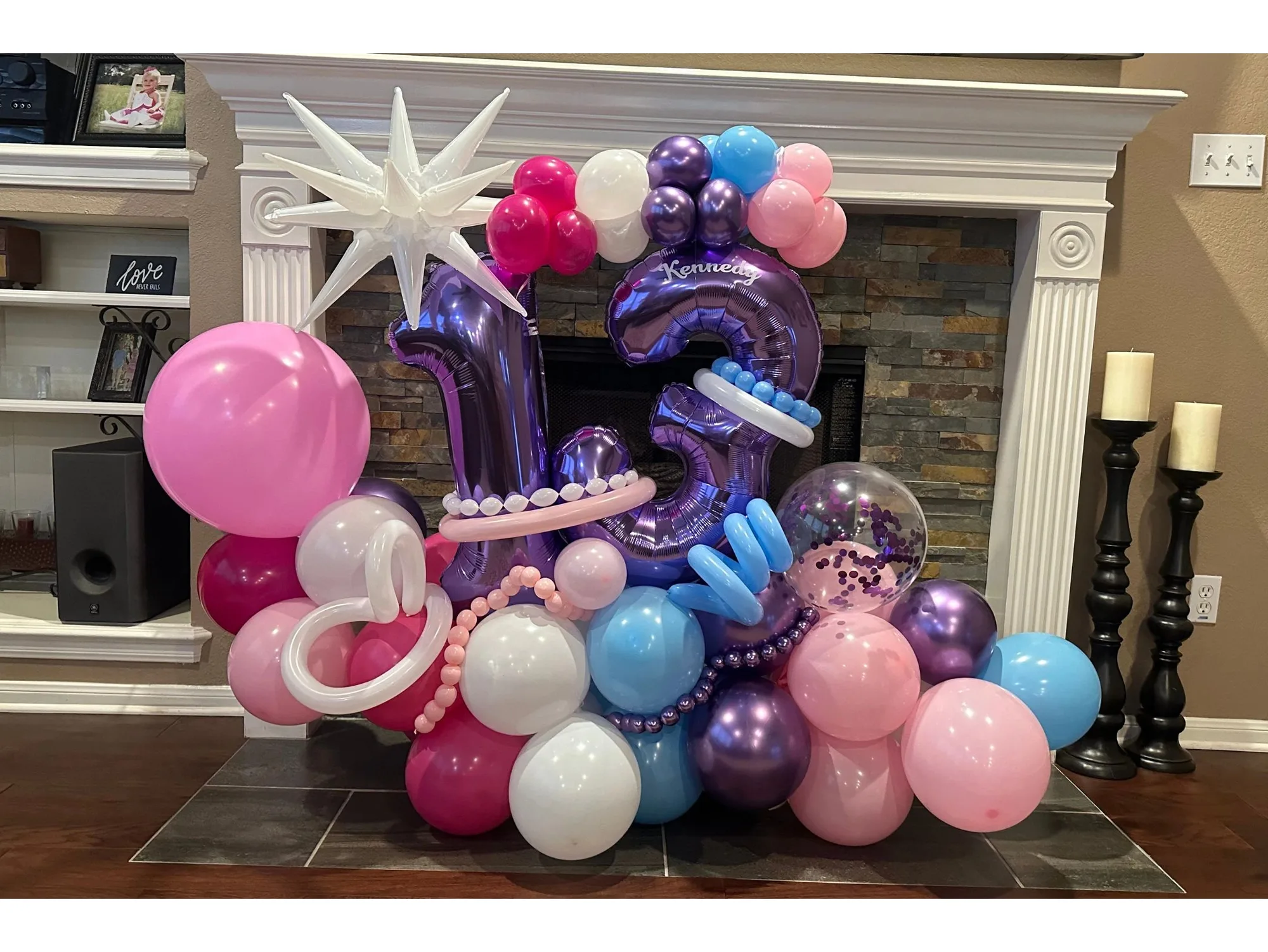 Purple thirteen freestanding balloon display with pink and blue accents