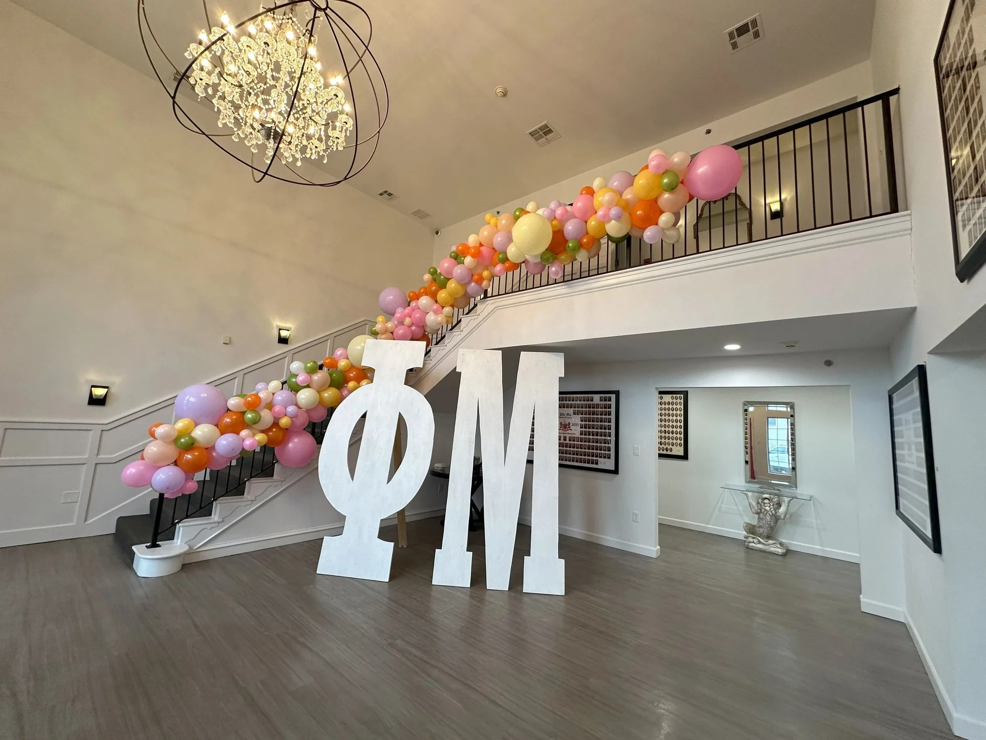 Pastel balloon garland following a staircase railing